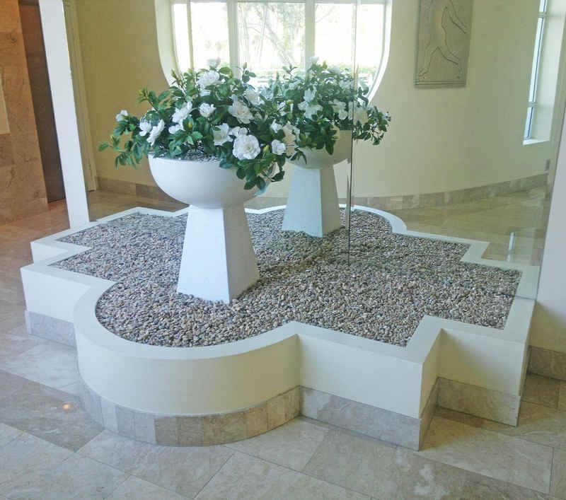 unusual bird-bath style greenery feature in foyer planter