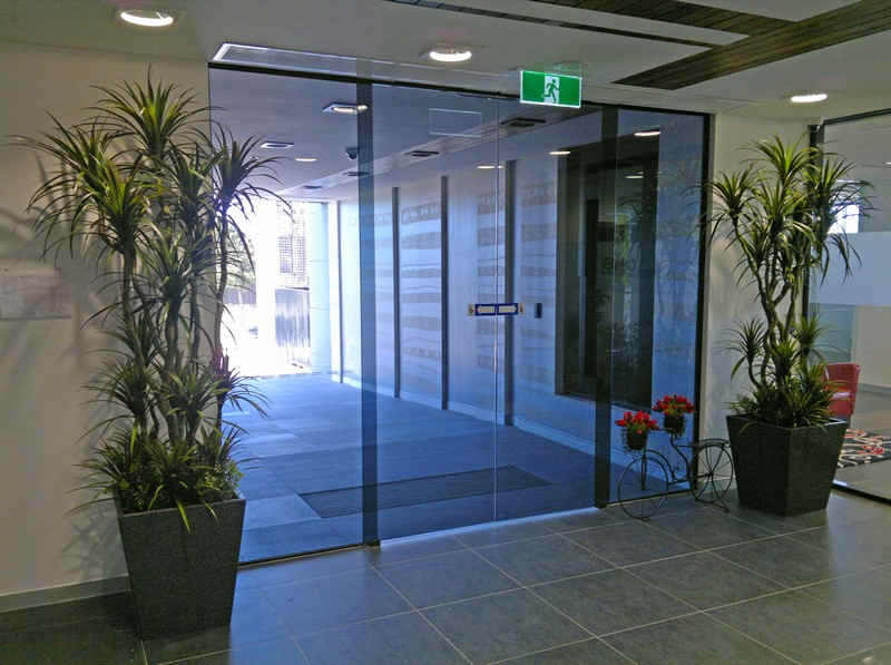 large matching planters either side of foyer entrance