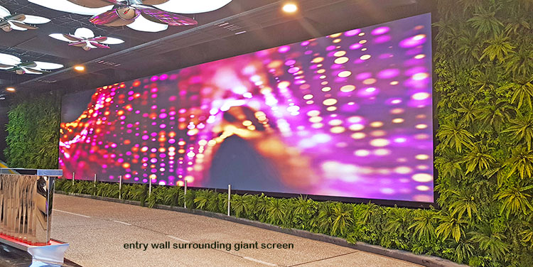 fern wall surrounds large foyer screen