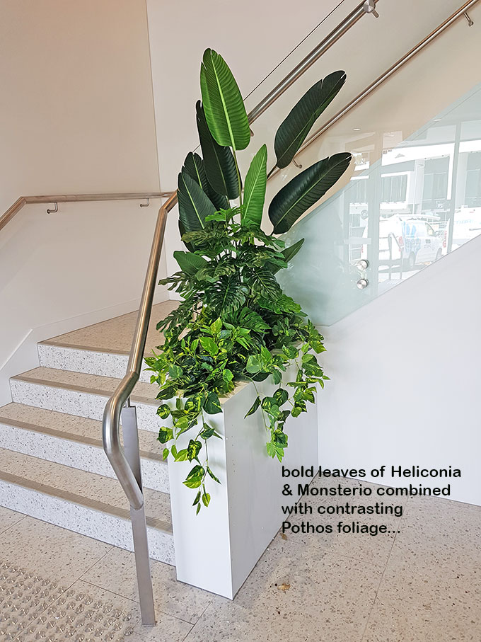 simple stairwell planter in foyer