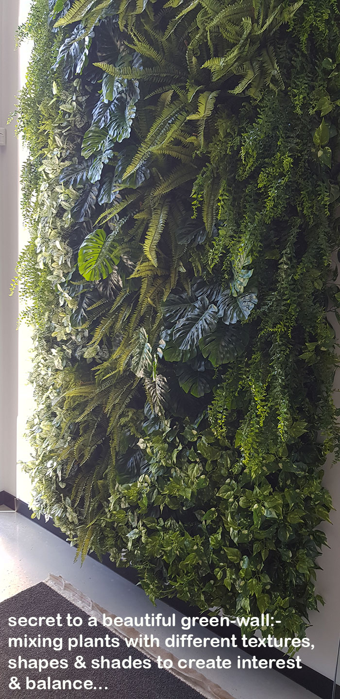 Back-lights add 'cool mood' to tall green-wall in lobby... image 6