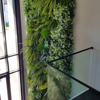 Back-lights add 'cool mood' to tall green-wall in lobby... poplet image 1