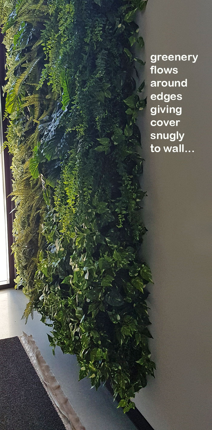 Back-lights add 'cool mood' to tall green-wall in lobby... image 7