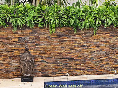 Artificial Green Wall finishes off pool side stone-wall...