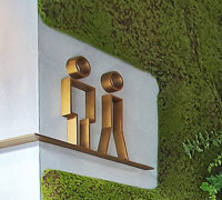 Mossy plant-wall gives softening 'green-touch' to modern restaurant/bar...