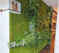 Mossy plant-wall gives softening 'green-touch' to modern restaurant/bar...