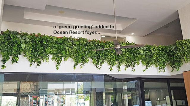 Easy-way to add greenery to a bare wall- resort foyer gets a 'green-hello'