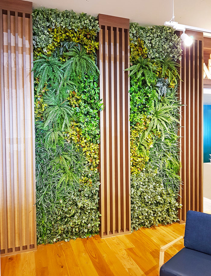 timber panels complemented by greenery on wall