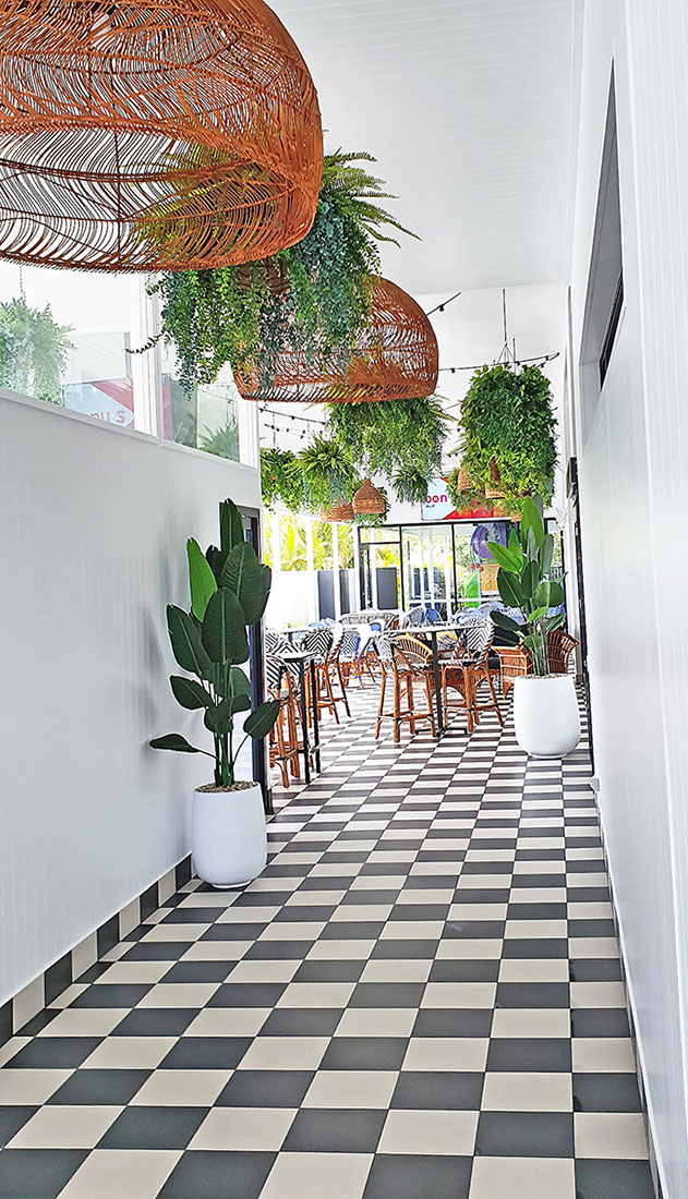 hotel entry has baskets leading patrons inside 