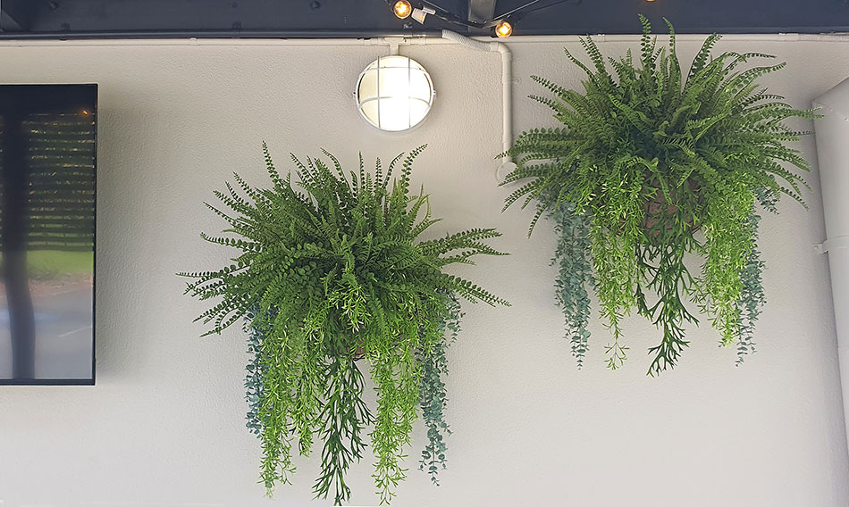 large wall baskets by screen in hotel