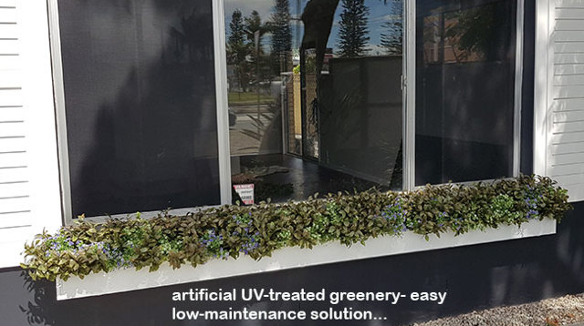 UV-treated artificial plants dress-up commercial building facade...