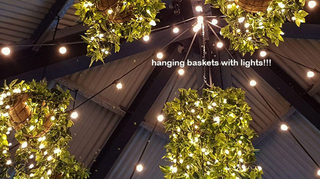 Hanging-Baskets with lights brighten up marina restaurant...
