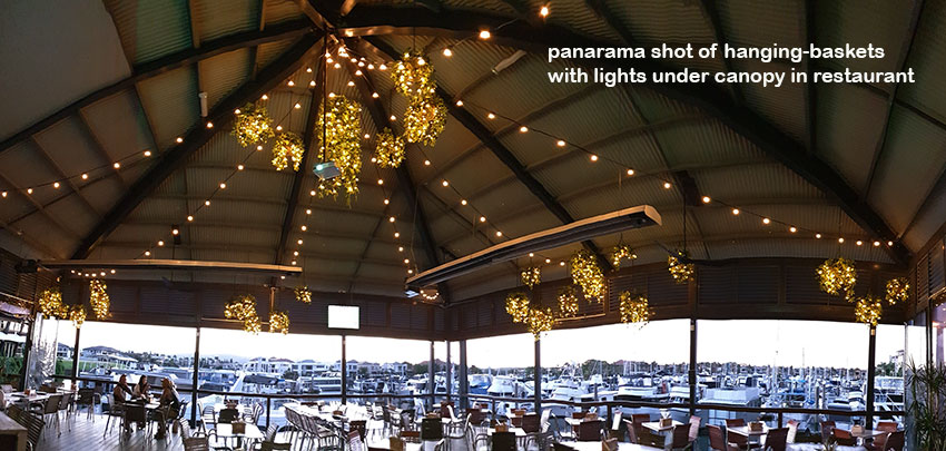 Hanging-Baskets with lights brighten up marina restaurant... image 2