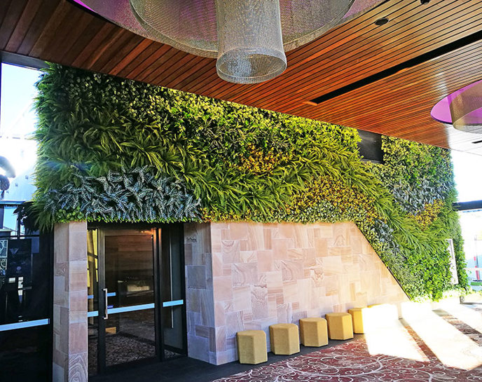 Artificial Green Wall flows seamlessly from outdoors into club foyer