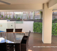 Turning an unsightly block wall into a green Feature...