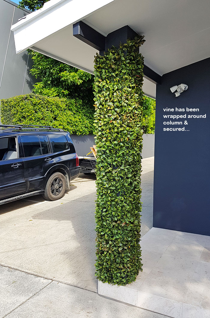 UV-treated artificial plants dress-up commercial building facade...