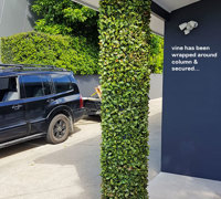 UV-treated artificial plants dress-up commercial building facade...