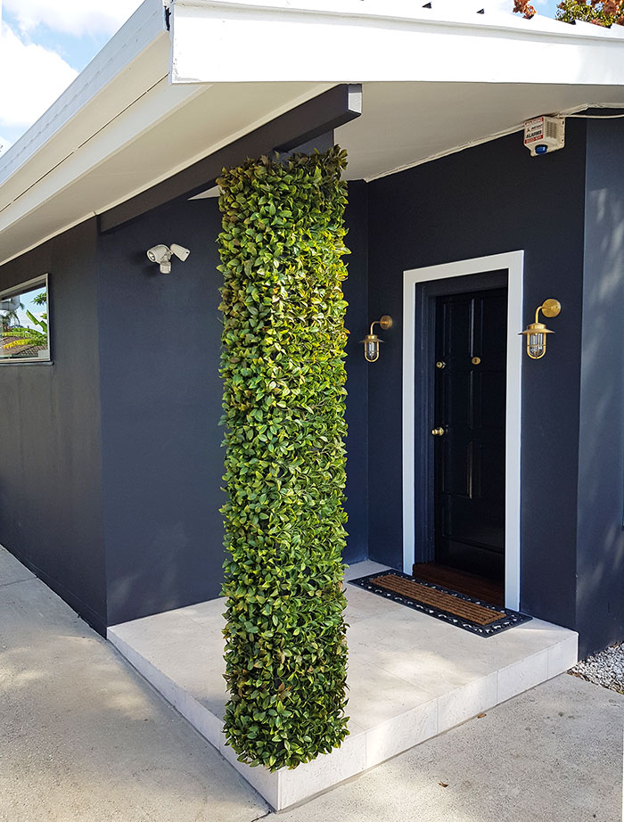 UV-treated artificial plants dress-up commercial building facade...