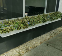 UV-treated artificial plants dress-up commercial building facade...