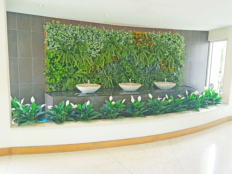 artificial plants are solution for tranquil Foyer Fountain setting...