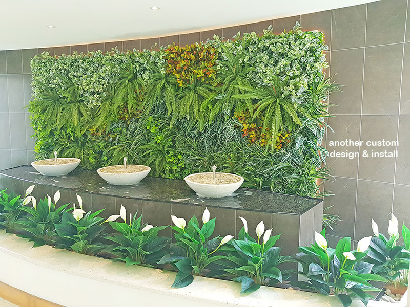 artificial plants are solution for tranquil Foyer Fountain setting...
