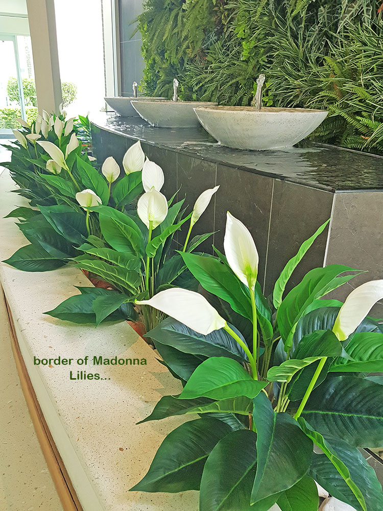 artificial plants are solution for tranquil Foyer Fountain setting...