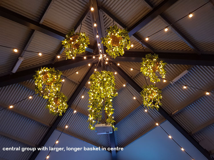 Hanging-Baskets with lights brighten up marina restaurant...