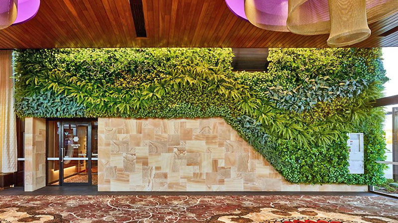 Artificial Green Wall flows seamlessly from outdoors into club foyer