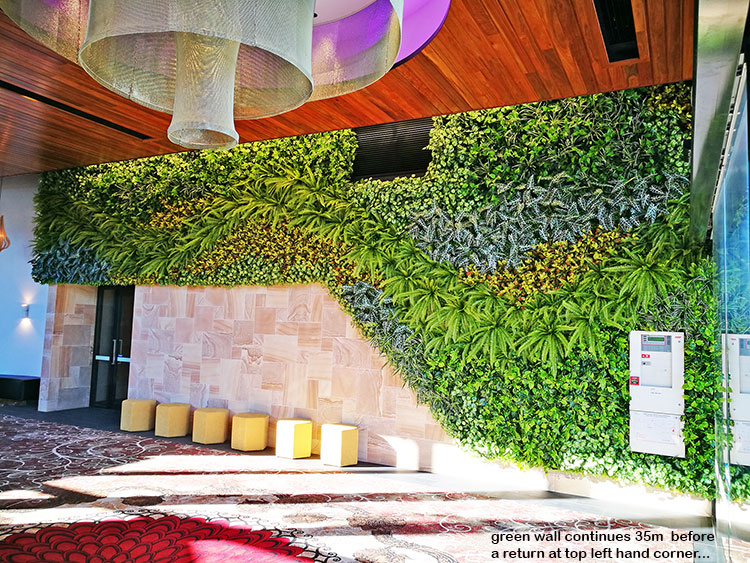 Artificial Green Wall flows seamlessly from outdoors into club foyer