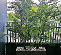 Green balcony privacy screen with UV-treated palms