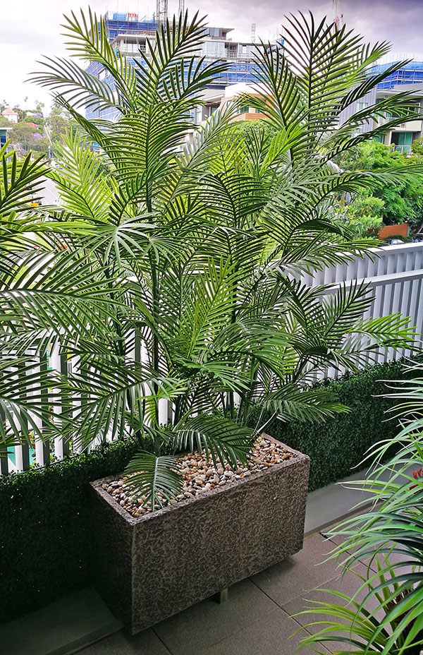 Green balcony privacy screen with UV-treated palms