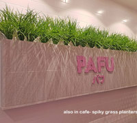 Cafe uses artificial green-vines for privacy screens & pergolas