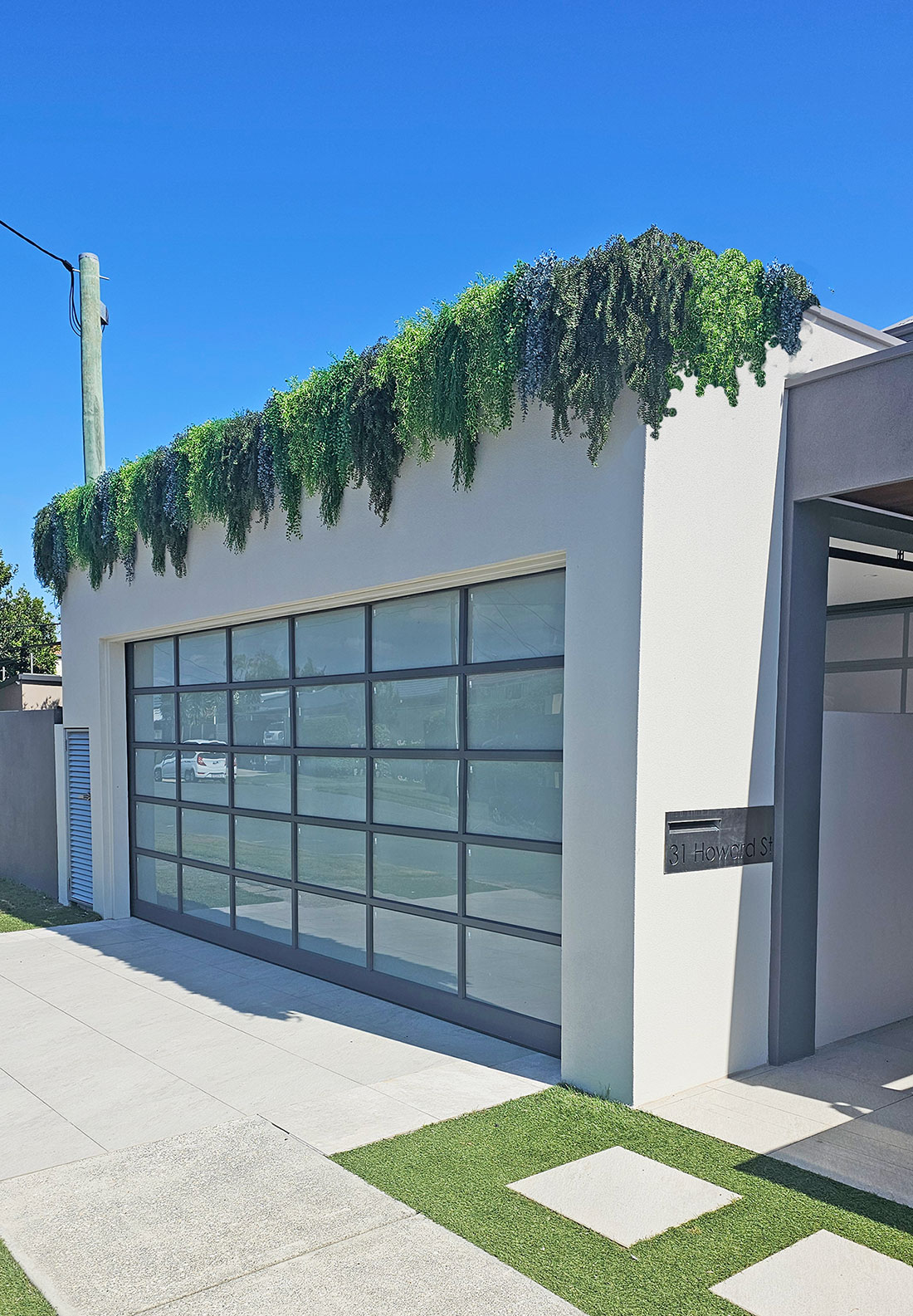 Garage facade softened by 'green-curtain'  