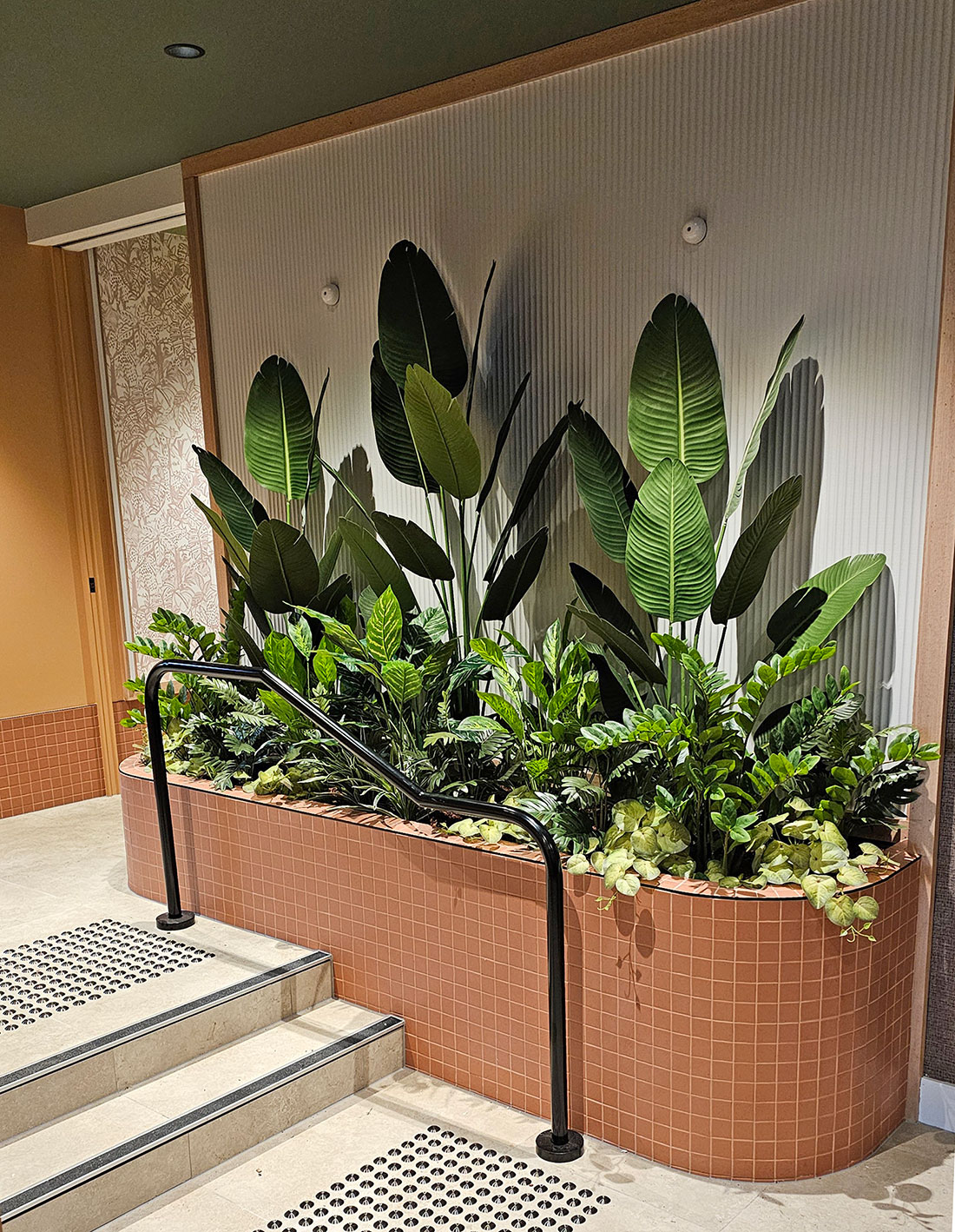 A stairway planter with lush mixed foliage...