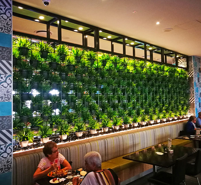 wall-of-pots divider in Club Eatery.