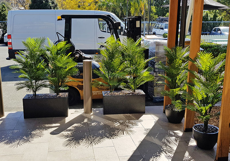 planters guide patrons around external parking areas