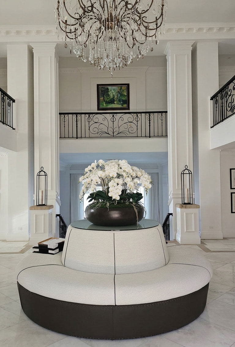 A huge artificial orchid bowl in foyer