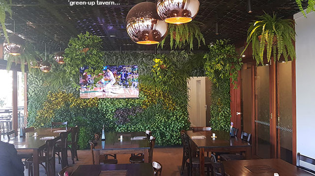 Tavern "green-over" with vertical-walls & hanging-baskets...