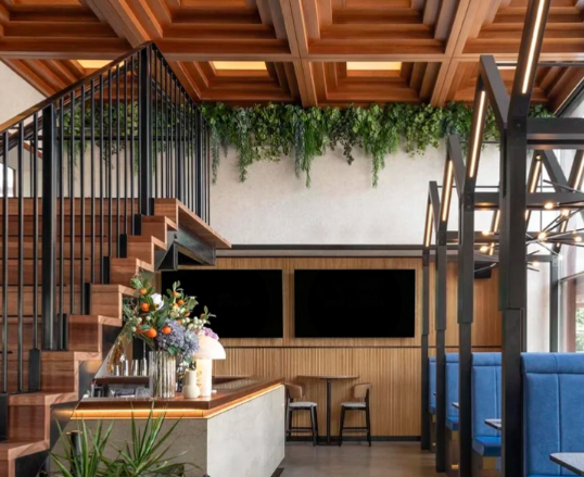 High Ceilings? artificial trailing greenery fills bare spaces
