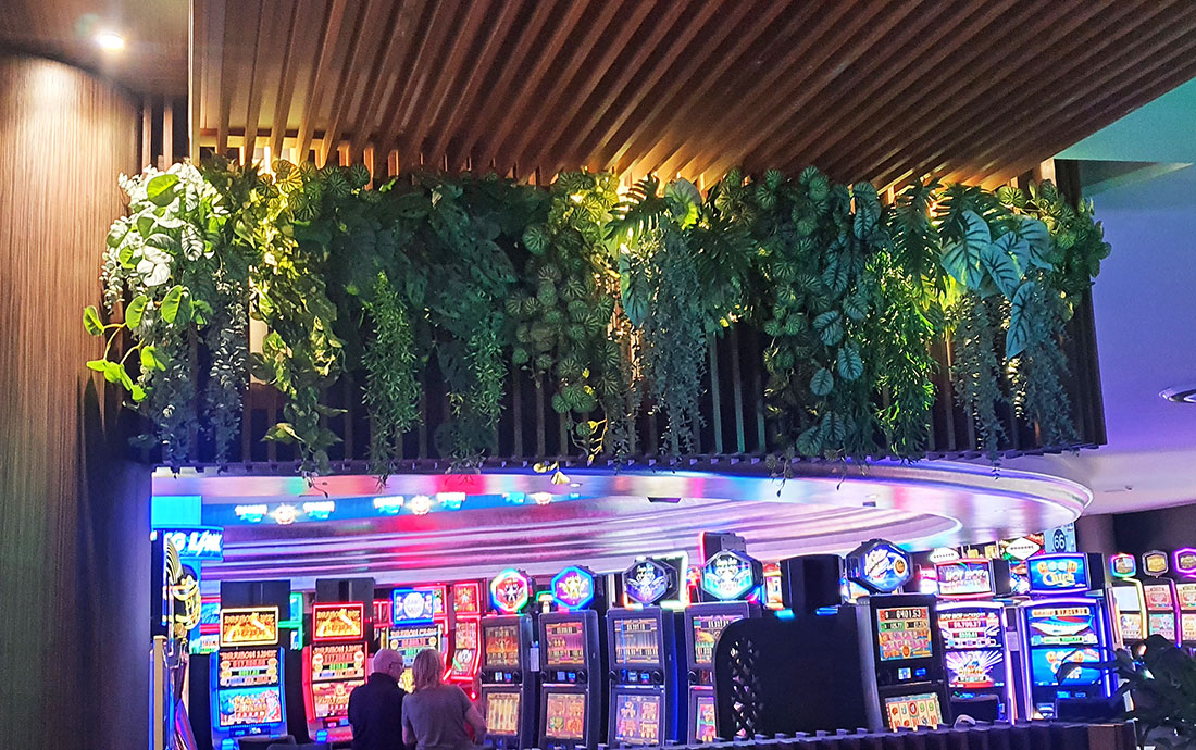 Gaming Room atmosphere enhanced by back-lit greenery