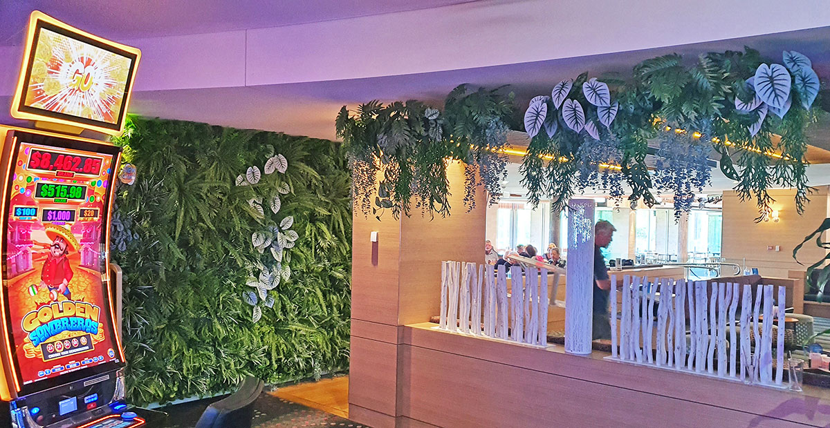 greenery helps separate Gaming from Dining Rooms